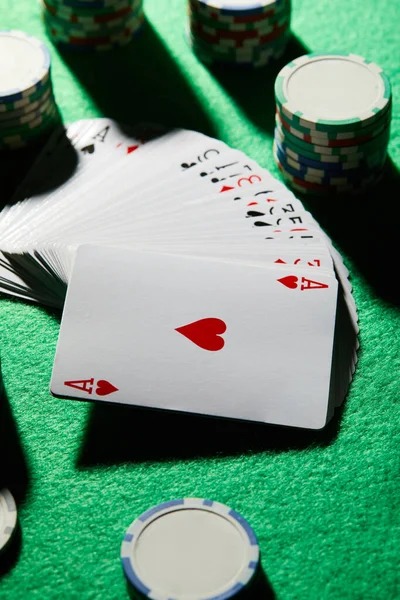 Mobile phone displaying a colorful slot game with spinning reels and payout information